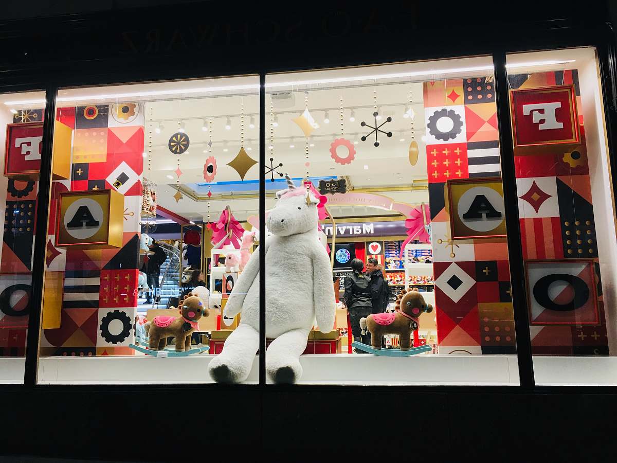 window display life-size white hippo plush toy human